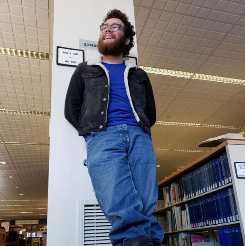 student in library